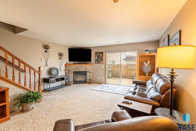1805 S Sertoma Ave Unit 105, Sioux Falls, SD 57106 - living room with carpet floors, a fireplace, a textured ceiling, and baseboards