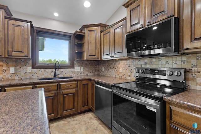 2300 Carson Cir, Tea, SD 57064 - kitchen featuring appliances with stainless steel finishes, a sink, dark countertops, decorative backsplash, and recessed lighting