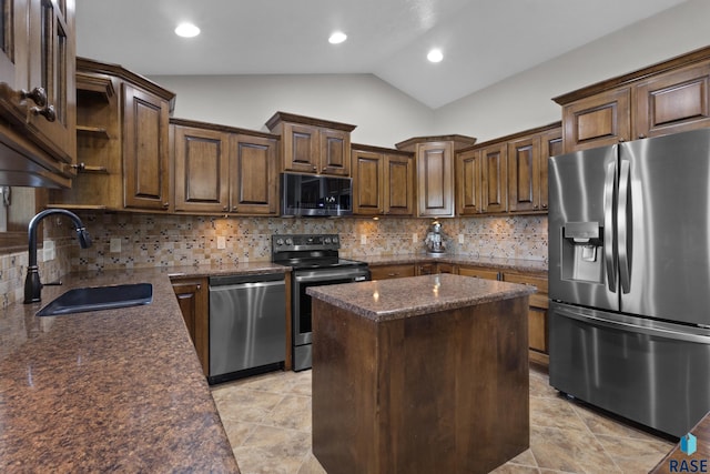 2300 Carson Cir, Tea, SD 57064 - kitchen featuring appliances with stainless steel finishes, a sink, lofted ceiling, a center island, and tasteful backsplash