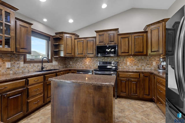 2300 Carson Cir, Tea, SD 57064 - kitchen with appliances with stainless steel finishes, a sink, vaulted ceiling, dark stone countertops, and backsplash