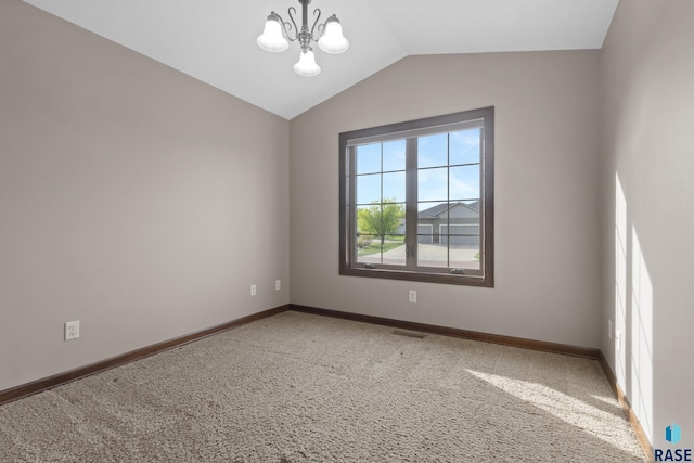 2300 Carson Cir, Tea, SD 57064 - empty room featuring vaulted ceiling, carpet, a chandelier, and baseboards