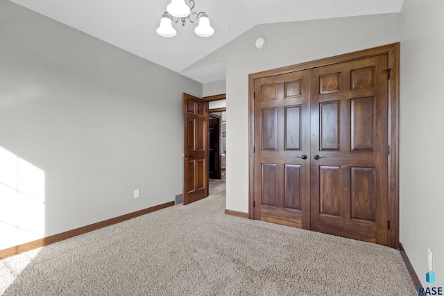 2300 Carson Cir, Tea, SD 57064 - unfurnished bedroom featuring a chandelier, carpet flooring, vaulted ceiling, baseboards, and a closet
