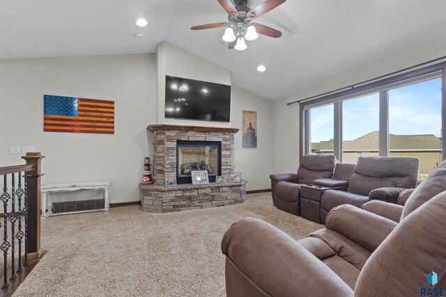2300 Carson Cir, Tea, SD 57064 - living room featuring vaulted ceiling, baseboards, a ceiling fan, a stone fireplace, and carpet flooring