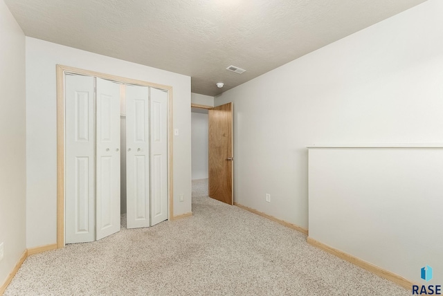 2604 N Wright Ave, Sioux Falls, SD 57107 - unfurnished bedroom with carpet, baseboards, and a closet