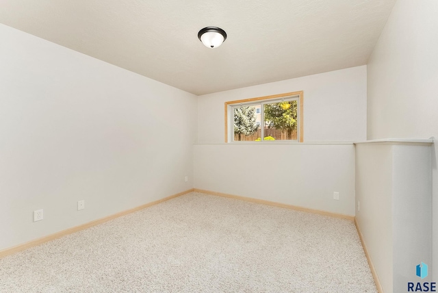 2604 N Wright Ave, Sioux Falls, SD 57107 - carpeted empty room with baseboards