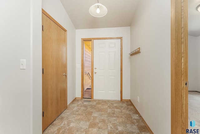 2604 N Wright Ave, Sioux Falls, SD 57107 - hallway featuring stone finish floors and baseboards
