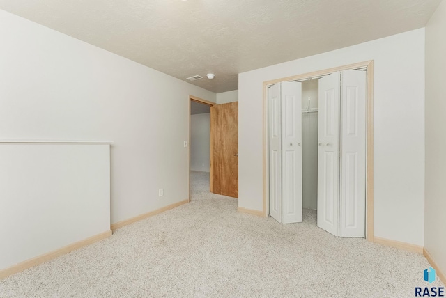 2604 N Wright Ave, Sioux Falls, SD 57107 - unfurnished bedroom featuring carpet, baseboards, and a closet