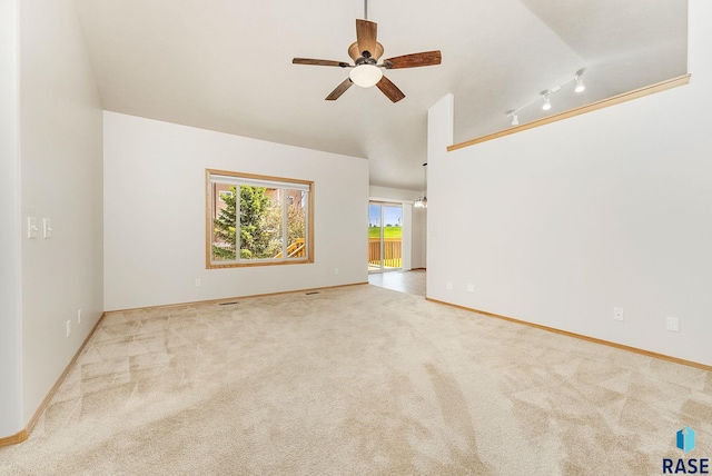 2604 N Wright Ave, Sioux Falls, SD 57107 - carpeted empty room with ceiling fan, baseboards, and vaulted ceiling