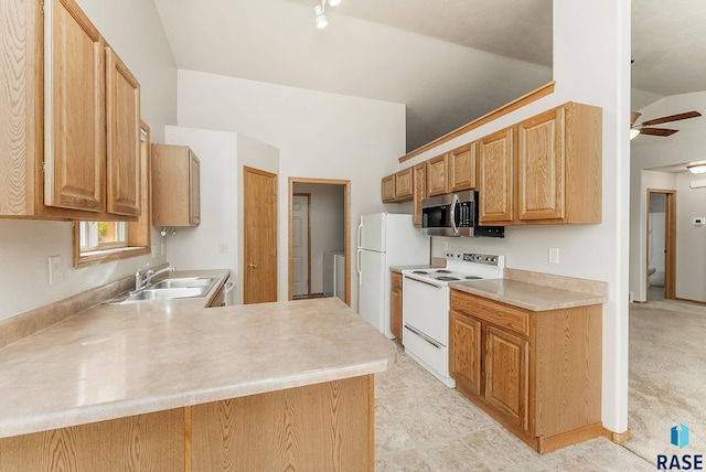 2604 N Wright Ave, Sioux Falls, SD 57107 - kitchen with white appliances, a sink, vaulted ceiling, light countertops, and ceiling fan
