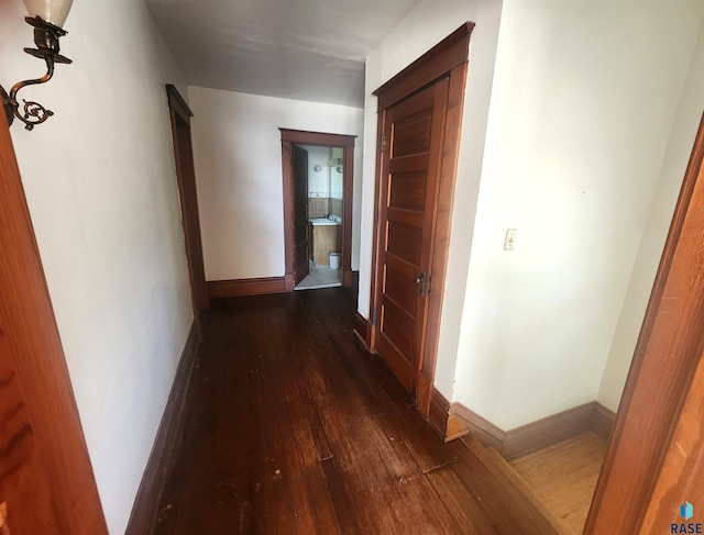220 E Lincoln Ave, Salem, SD 57058 - corridor with dark wood finished floors and baseboards