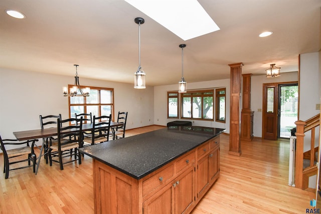 4600 S Harrington Ave, Sioux Falls, SD 57103 - kitchen featuring light wood-type flooring, a kitchen island, a chandelier, recessed lighting, and hanging light fixtures