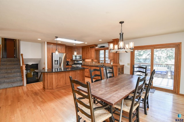 4600 S Harrington Ave, Sioux Falls, SD 57103 - dining room with light wood-style flooring, stairs, recessed lighting, and a chandelier