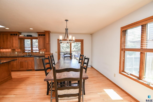 4600 S Harrington Ave, Sioux Falls, SD 57103 - dining space with light wood-style flooring, a chandelier, recessed lighting, and baseboards