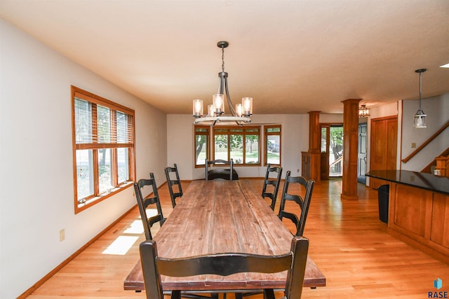 4600 S Harrington Ave, Sioux Falls, SD 57103 - dining area featuring light wood-style floors, a chandelier, and baseboards