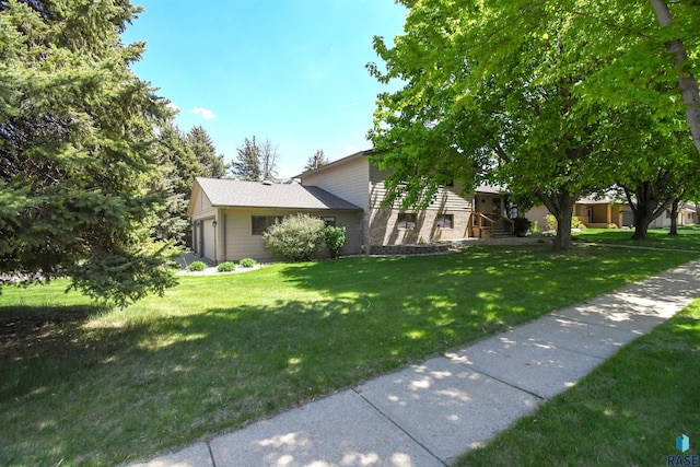 4600 S Harrington Ave, Sioux Falls, SD 57103 - view of property exterior with a yard and an attached garage