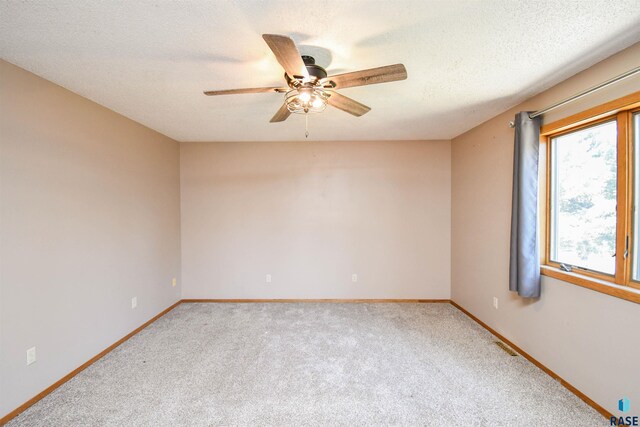 4600 S Harrington Ave, Sioux Falls, SD 57103 - carpeted empty room featuring a ceiling fan and baseboards
