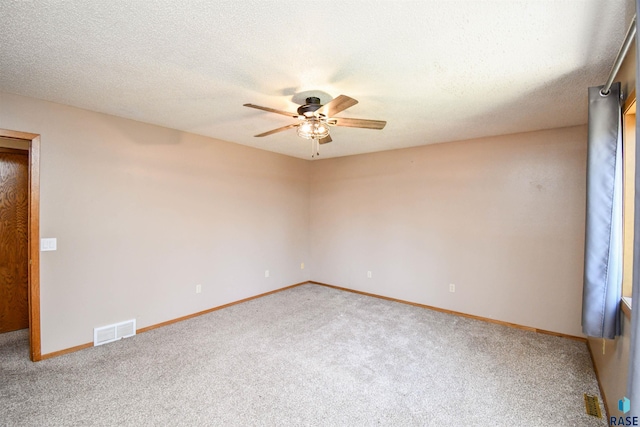 4600 S Harrington Ave, Sioux Falls, SD 57103 - carpeted spare room featuring a ceiling fan, baseboards, and a textured ceiling