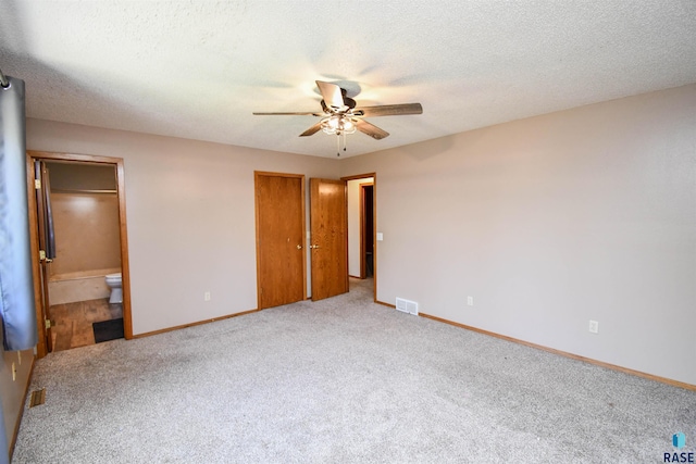 4600 S Harrington Ave, Sioux Falls, SD 57103 - unfurnished bedroom featuring carpet floors, connected bathroom, baseboards, ceiling fan, and a textured ceiling