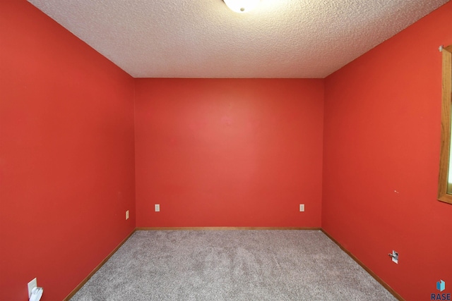 4600 S Harrington Ave, Sioux Falls, SD 57103 - carpeted spare room featuring a textured ceiling and baseboards