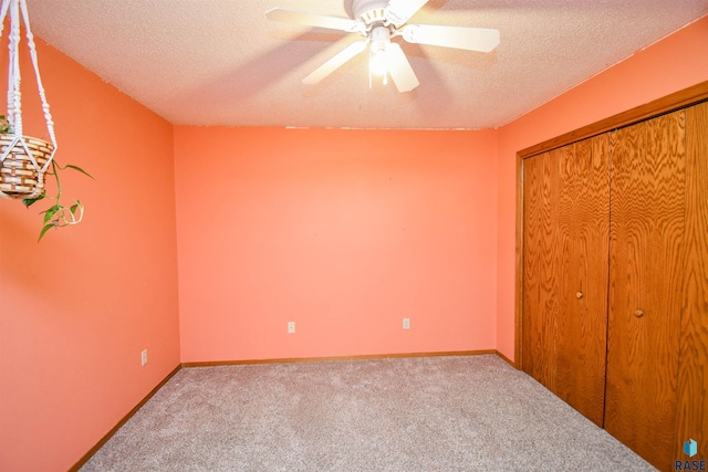 4600 S Harrington Ave, Sioux Falls, SD 57103 - unfurnished bedroom with a textured ceiling, carpet, a closet, a ceiling fan, and baseboards