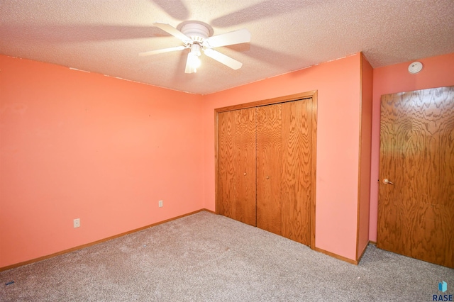 4600 S Harrington Ave, Sioux Falls, SD 57103 - unfurnished bedroom with carpet floors, a textured ceiling, a closet, a ceiling fan, and baseboards