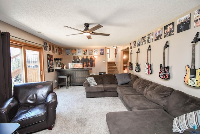 4600 S Harrington Ave, Sioux Falls, SD 57103 - carpeted living room with a dry bar, stairs, a ceiling fan, and a textured ceiling