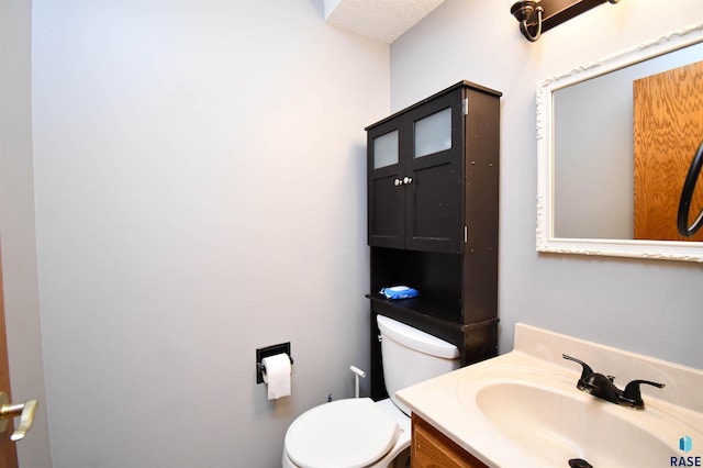 4600 S Harrington Ave, Sioux Falls, SD 57103 - half bathroom featuring toilet and vanity
