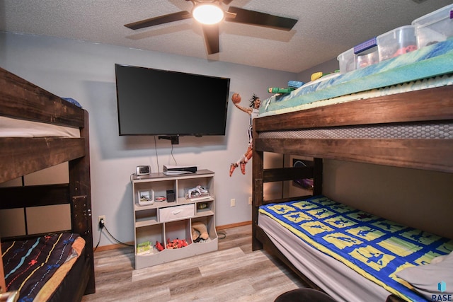 4600 S Harrington Ave, Sioux Falls, SD 57103 - bedroom with wood finished floors, a textured ceiling, and ceiling fan