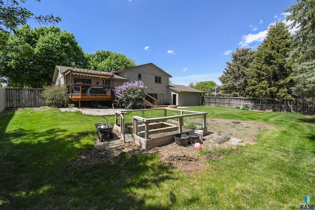4600 S Harrington Ave, Sioux Falls, SD 57103 - view of yard featuring a wooden deck and a vegetable garden