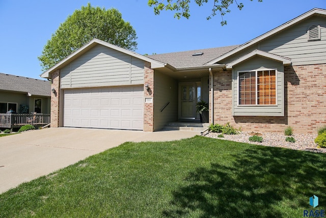 5223 E Pop Fly Pl, Sioux Falls, SD 57110 - ranch-style home with brick siding, driveway, a garage, and a front lawn