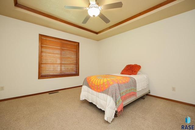5223 E Pop Fly Pl, Sioux Falls, SD 57110 - bedroom featuring a raised ceiling, carpet flooring, baseboards, and crown molding