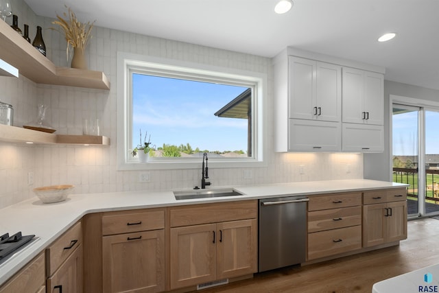 2009 S Firestone Ln, Sioux Falls, SD 57110 - kitchen featuring open shelves, stainless steel appliances, a sink, decorative backsplash, and light wood-style floors