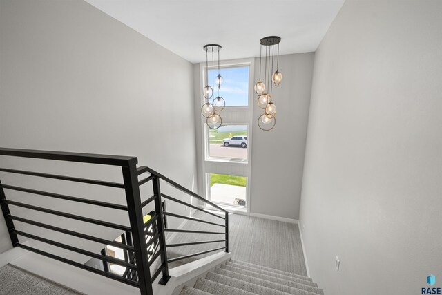 2009 S Firestone Ln, Sioux Falls, SD 57110 - stairway with carpet flooring, plenty of natural light, and baseboards