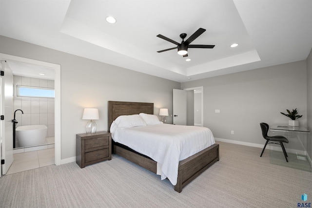 2009 S Firestone Ln, Sioux Falls, SD 57110 - bedroom featuring a tray ceiling, light carpet, recessed lighting, baseboards, and connected bathroom