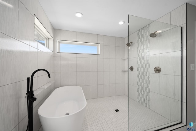 2009 S Firestone Ln, Sioux Falls, SD 57110 - bathroom with a soaking tub, walk in shower, and recessed lighting