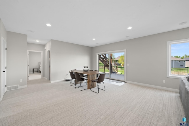2009 S Firestone Ln, Sioux Falls, SD 57110 - dining area featuring light colored carpet, baseboards, and recessed lighting