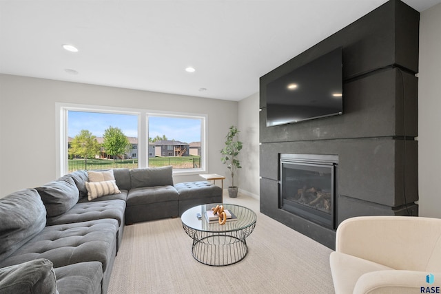 2009 S Firestone Ln, Sioux Falls, SD 57110 - living room featuring a glass covered fireplace, recessed lighting, and baseboards