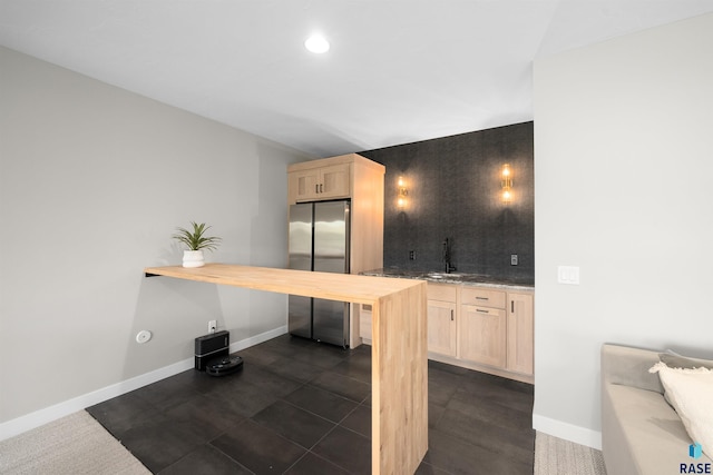 2009 S Firestone Ln, Sioux Falls, SD 57110 - kitchen with freestanding refrigerator, light brown cabinetry, butcher block countertops, baseboards, and recessed lighting