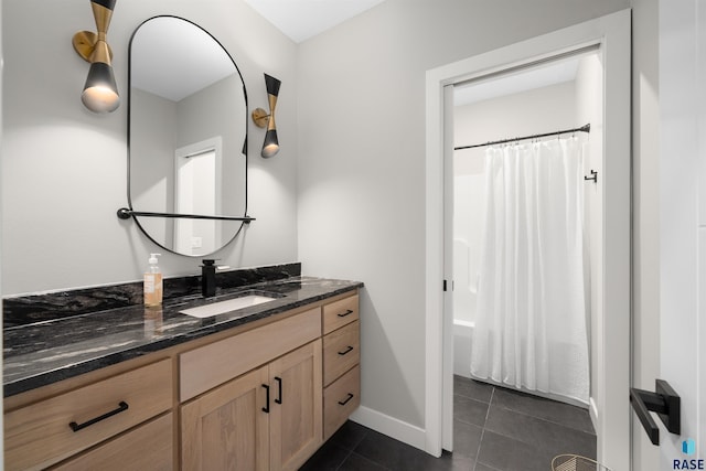 2009 S Firestone Ln, Sioux Falls, SD 57110 - bathroom with tile patterned flooring, vanity, baseboards, and shower / tub combo