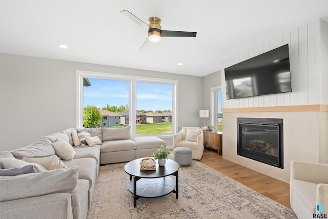 2009 S Firestone Ln, Sioux Falls, SD 57110 - living room featuring ceiling fan, a glass covered fireplace, light wood-style floors, and recessed lighting