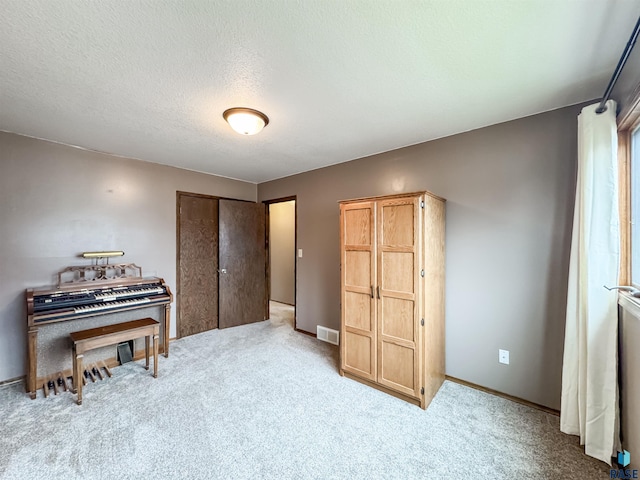 120 S Yellowstone Dr, Brandon, SD 57005 - carpeted bedroom with baseboards, a closet, and a textured ceiling