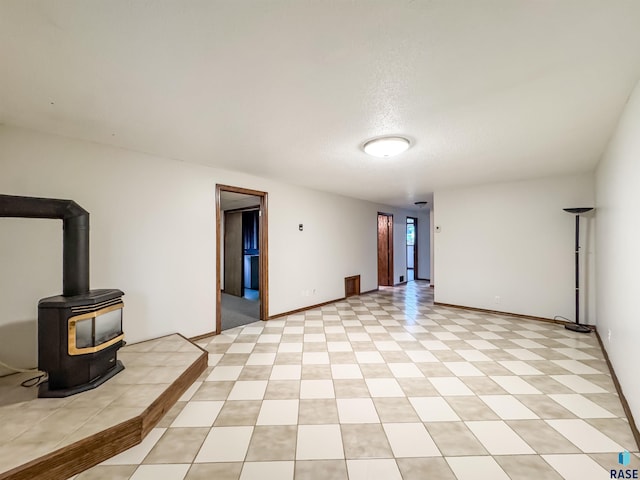 120 S Yellowstone Dr, Brandon, SD 57005 - unfurnished living room with a wood stove
