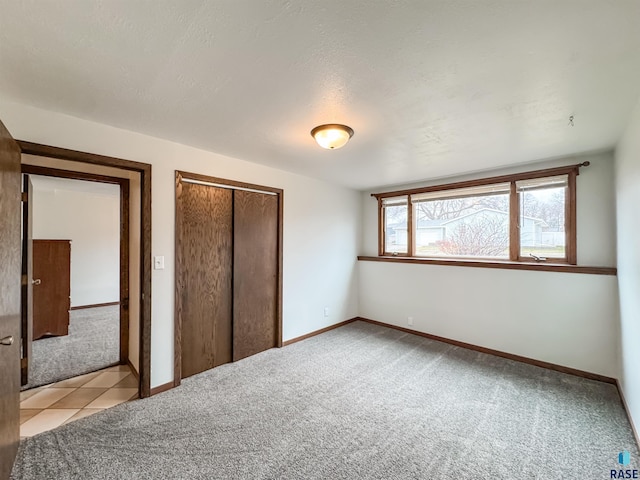 120 S Yellowstone Dr, Brandon, SD 57005 - unfurnished bedroom featuring light carpet, a closet, and baseboards