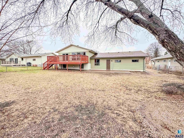 120 S Yellowstone Dr, Brandon, SD 57005 - back of house with a wooden deck, fence, and stairs