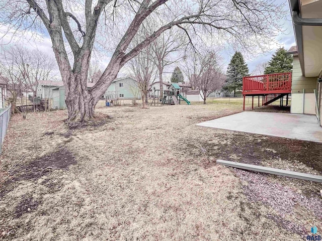 120 S Yellowstone Dr, Brandon, SD 57005 - view of yard with fence, a playground, a patio, a deck, and stairs