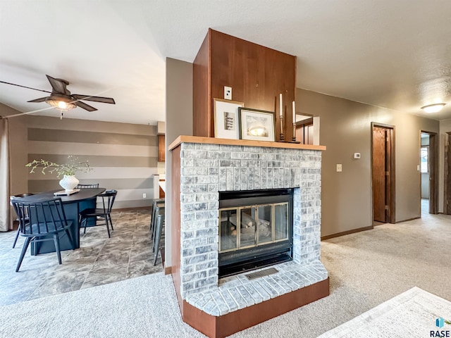 120 S Yellowstone Dr, Brandon, SD 57005 - living area with ceiling fan, a fireplace, baseboards, and light colored carpet