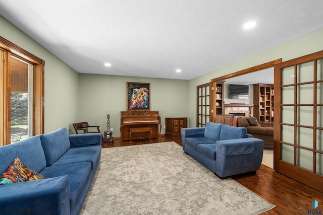 48190 265th St, Brandon, SD 57005 - living room featuring dark wood-style floors, recessed lighting, and a fireplace