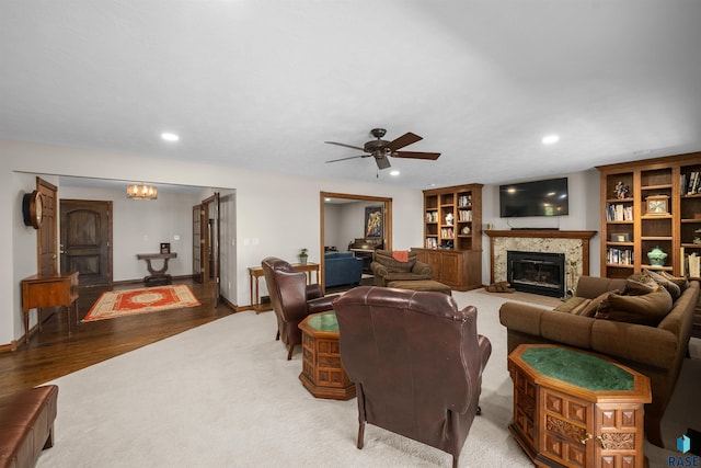 48190 265th St, Brandon, SD 57005 - living area featuring a fireplace, carpet floors, wood finished floors, recessed lighting, and baseboards