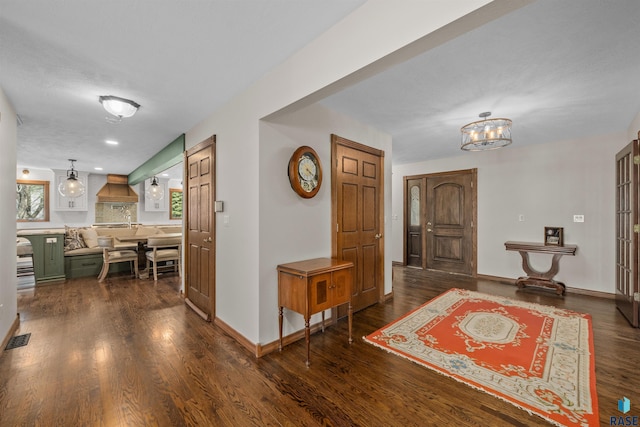 48190 265th St, Brandon, SD 57005 - entrance foyer with wood finished floors, a chandelier, and baseboards