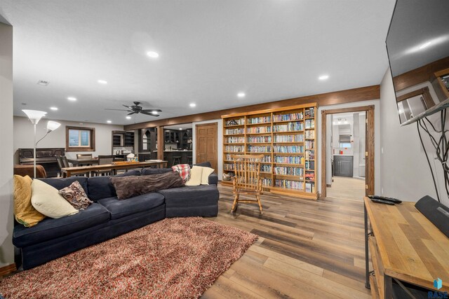 48190 265th St, Brandon, SD 57005 - living area featuring wood finished floors, recessed lighting, and ceiling fan